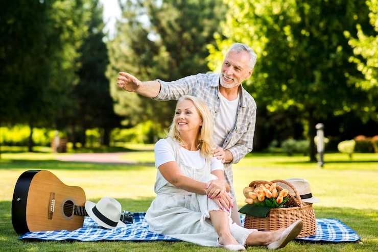 elderly-smiley-couple-looking-away-park_23-2148231789